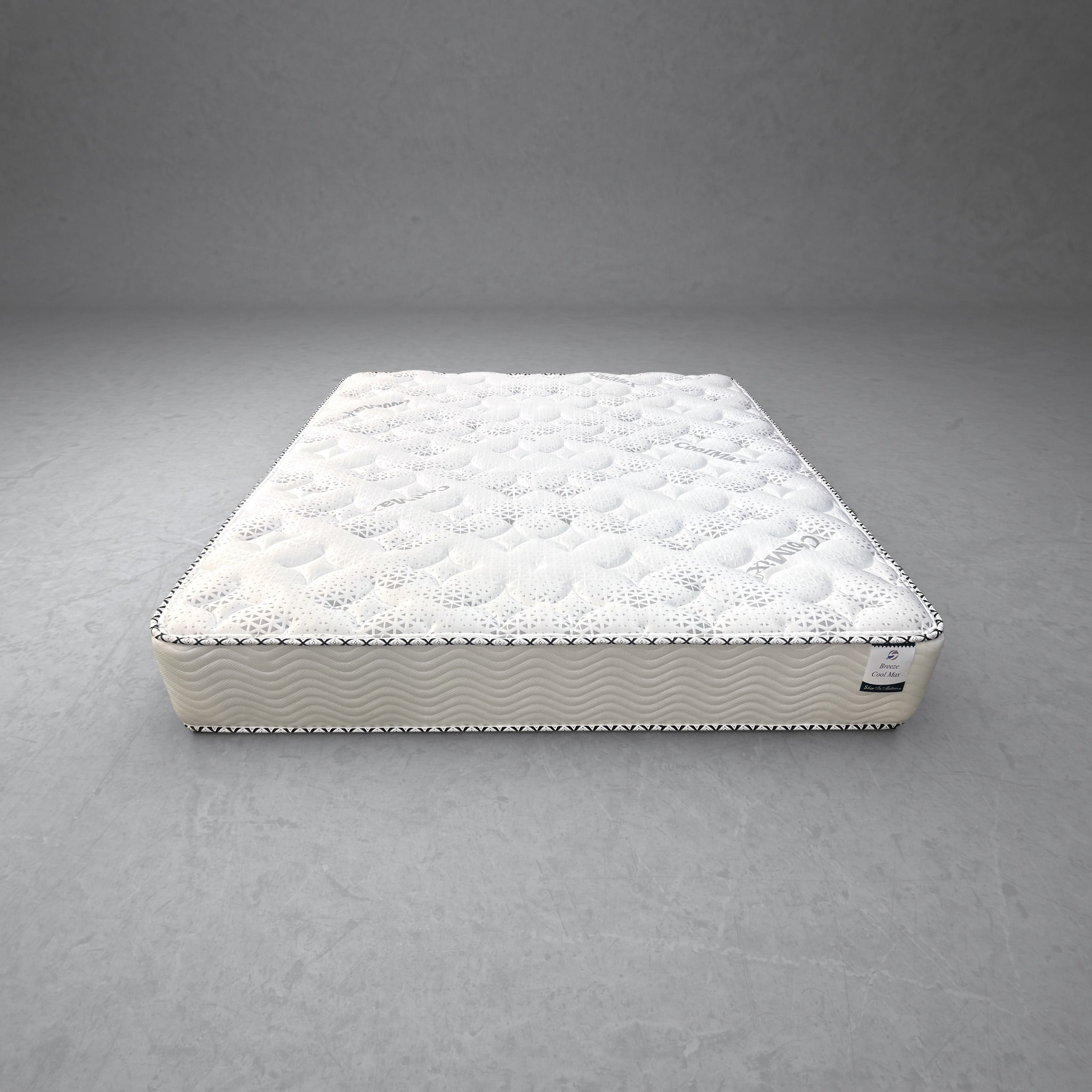 Olympic Queen Breeze Cool Max 10" Medium Firm Tight top mattress on a concrete background