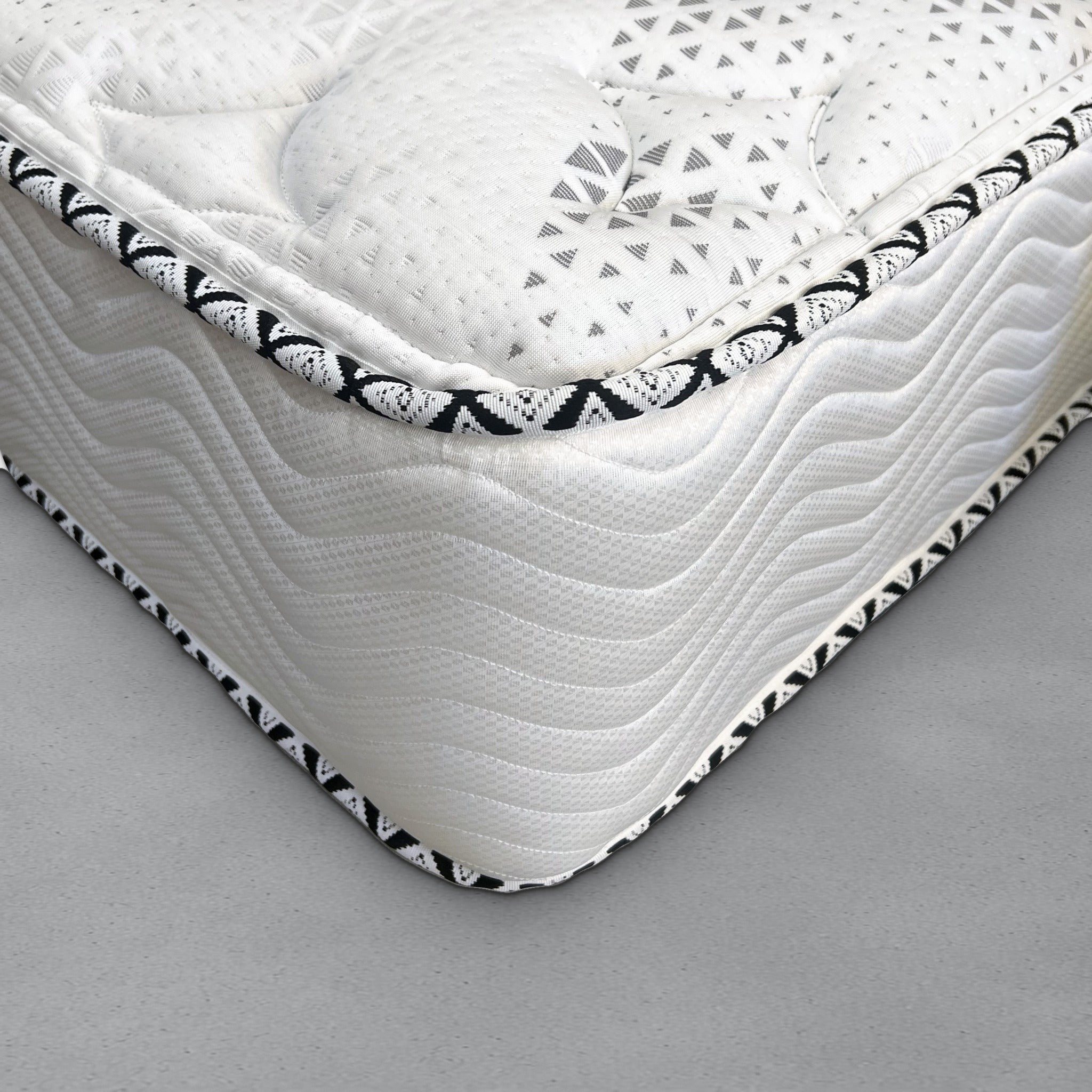 Corner close-up of the Breeze Cool Max 10" Medium Firm Tight top Hybrid / Pocket Coil mattress